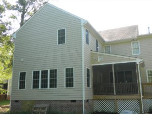 Beige two-story house with screened porch
