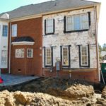 Brick house renovation with front excavation