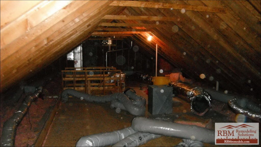 Attic with ductwork and exposed wooden rafters